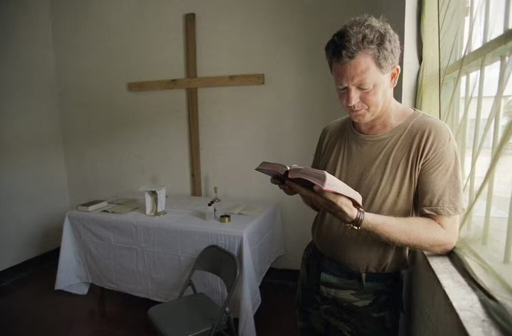 U.S. Air Force Chaplain Stephan Borlang reads his Bible in a makeshift chapel in Mogadishu, Somalia, in 1992. AP Photo/Lynne Sladky