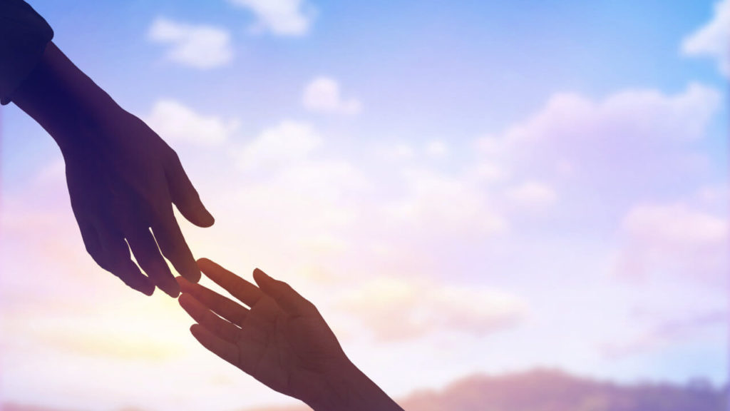 Hands reaching for each other